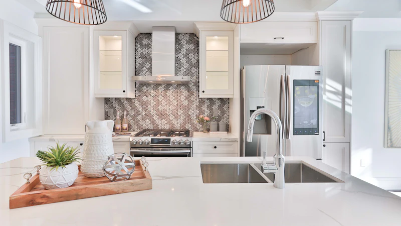 A bright, spotless kitchen with clear counters and polished surfaces